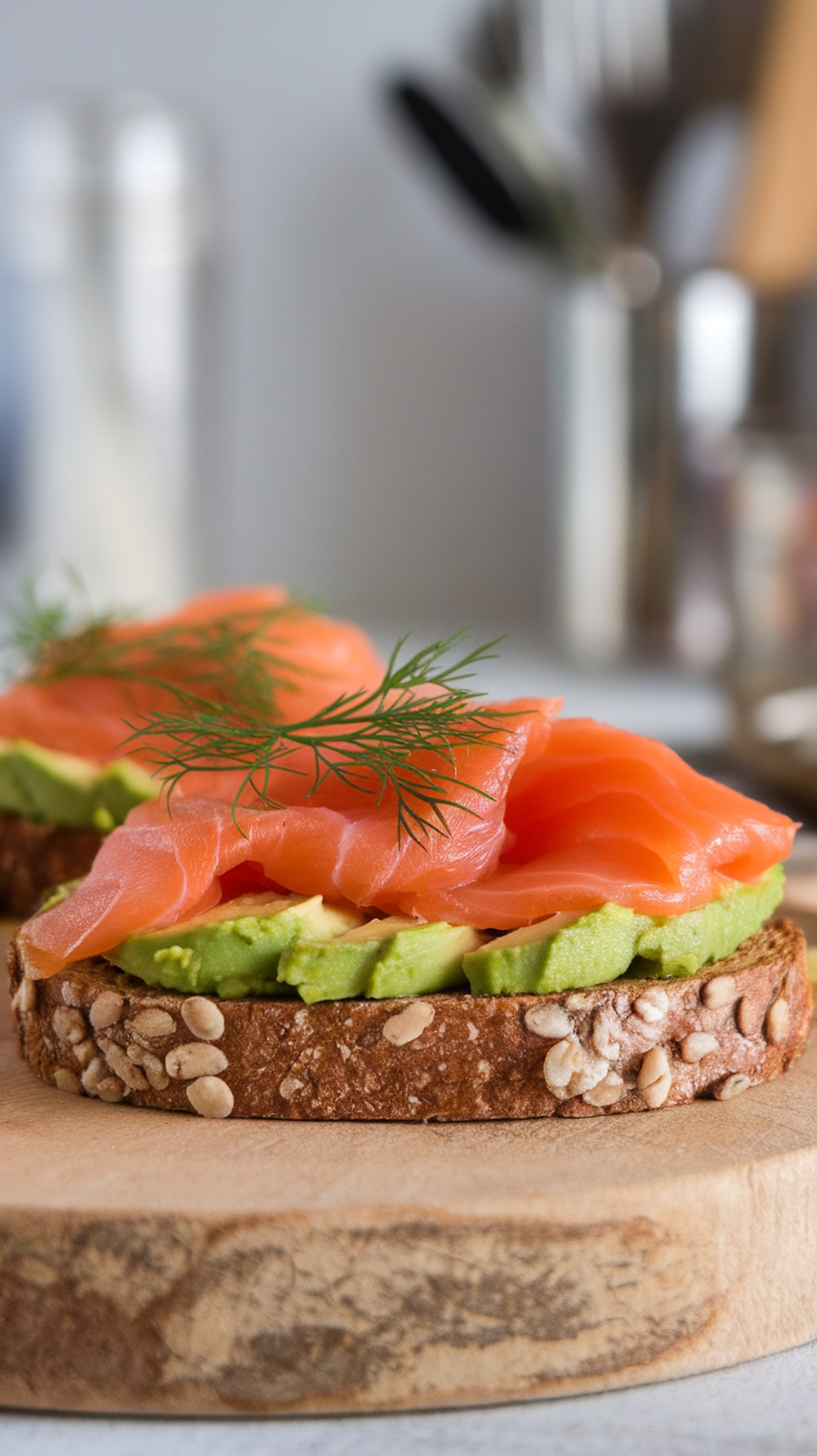 Smoked salmon and avocado toast on a wooden serving board