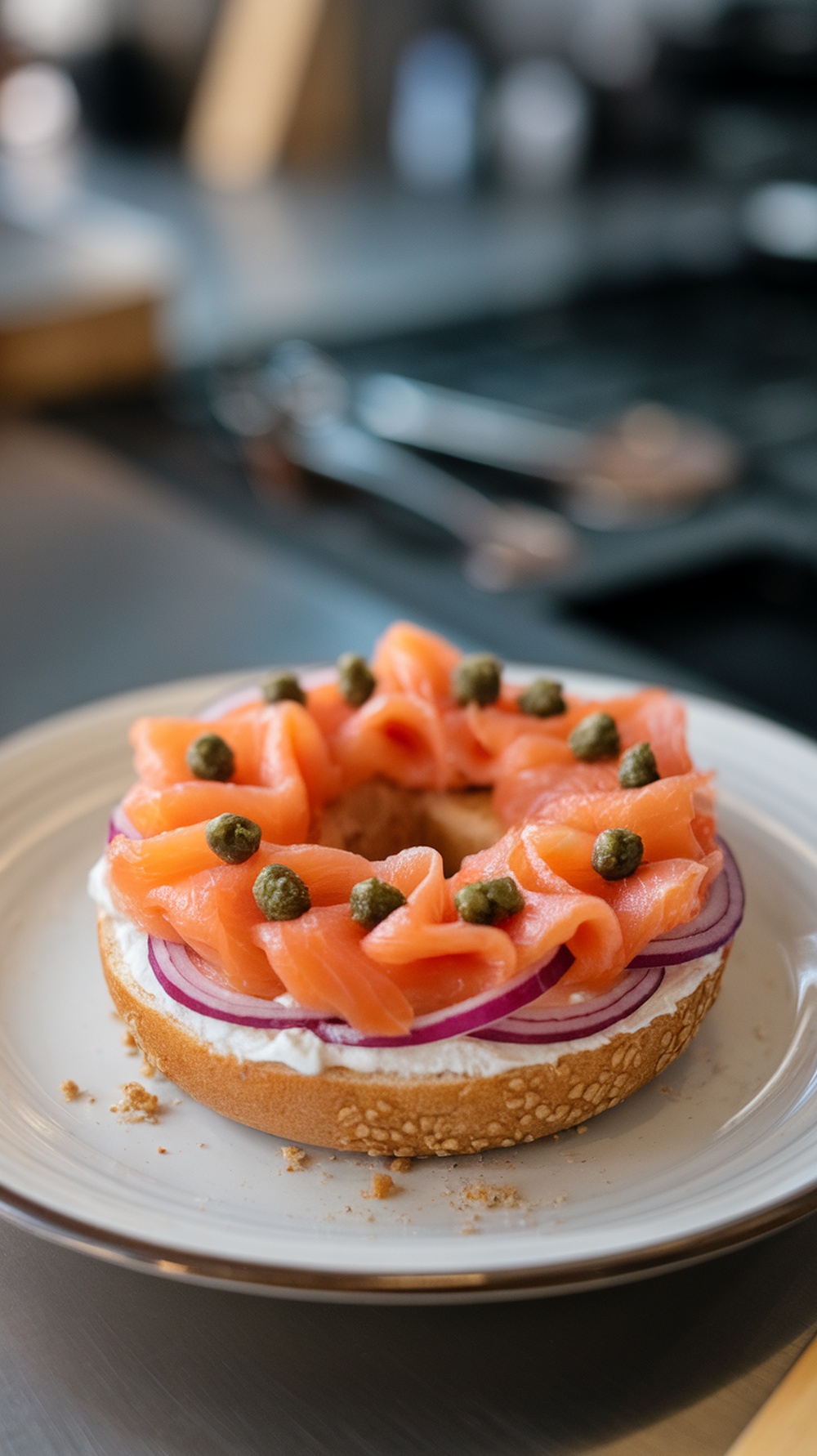 A smoked salmon and cream cheese bagel topped with red onions and capers.