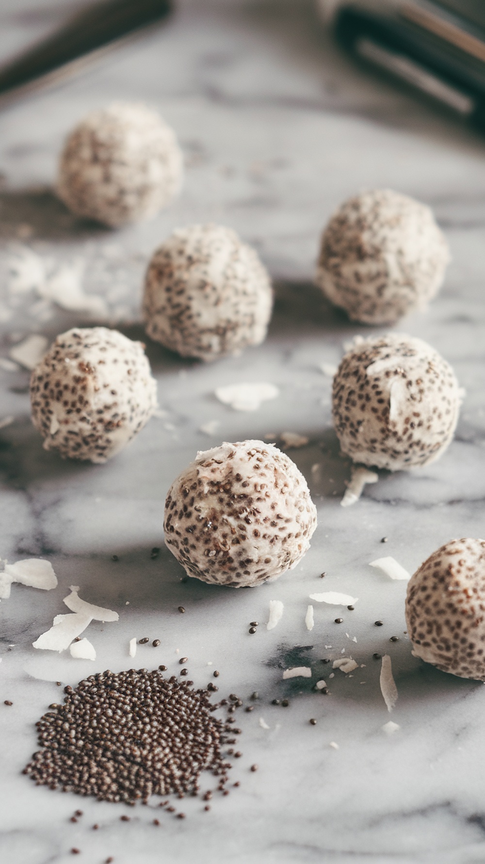 Coconut Chia Seed Energy Balls on a marble surface