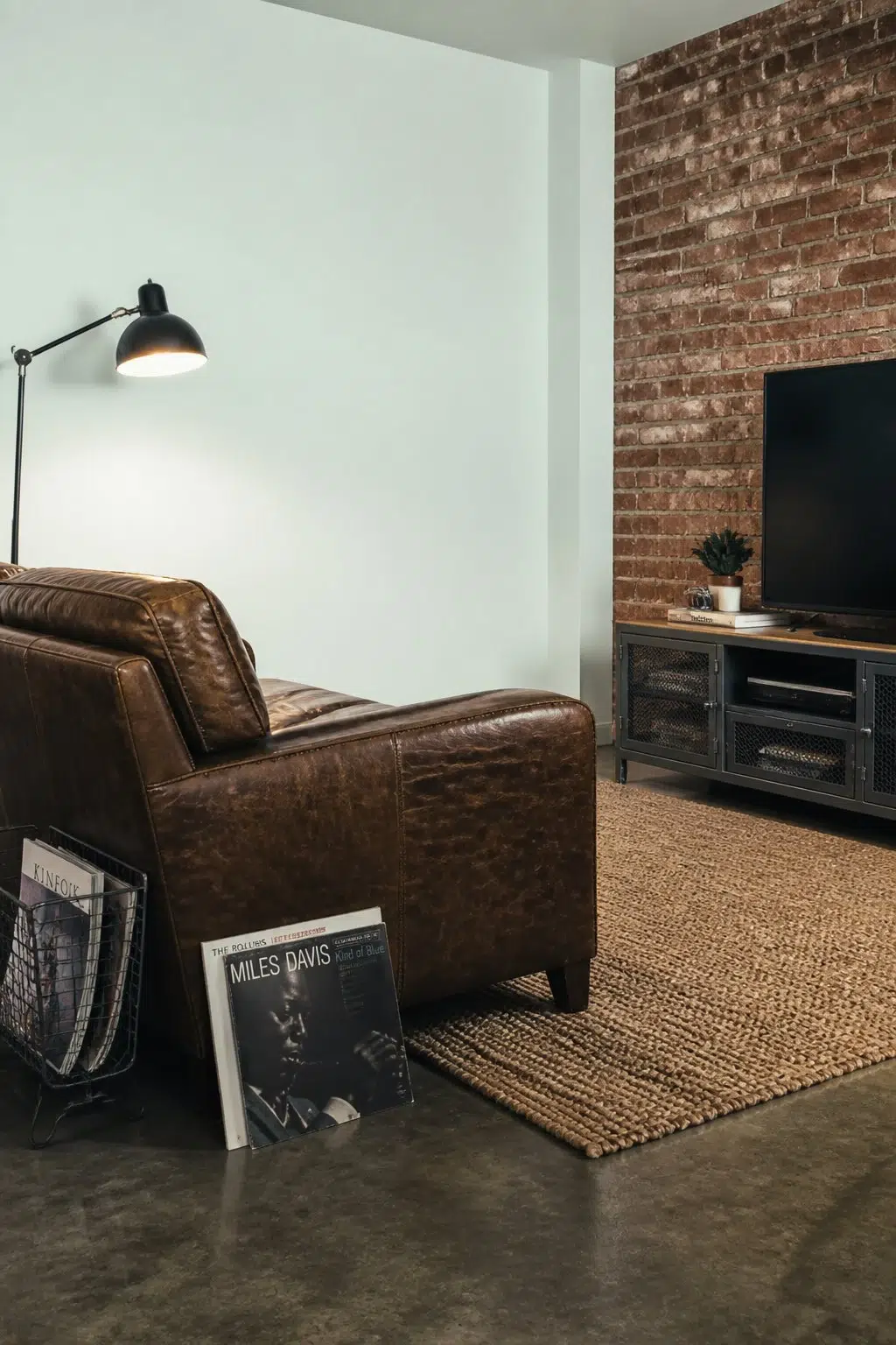A industrial living room painted in Aquacade 226