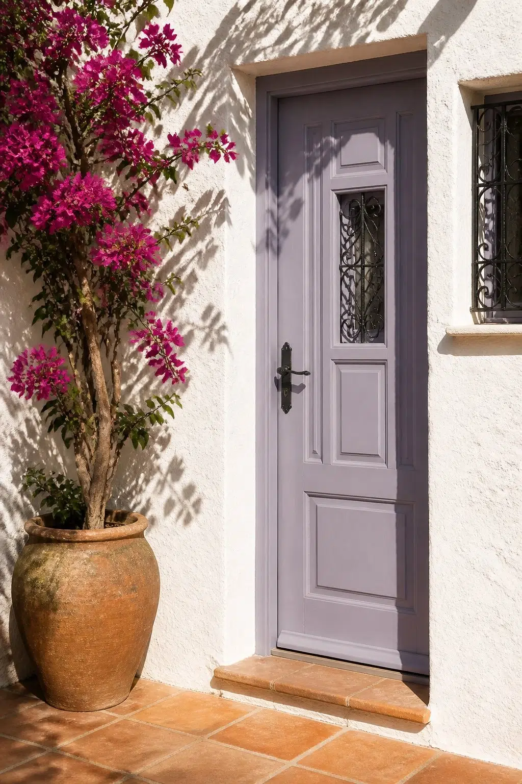 mediterranean front door featuring Ash Violet by Sherwin-Williams
